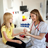 Nurse and young patient at primary care clinic